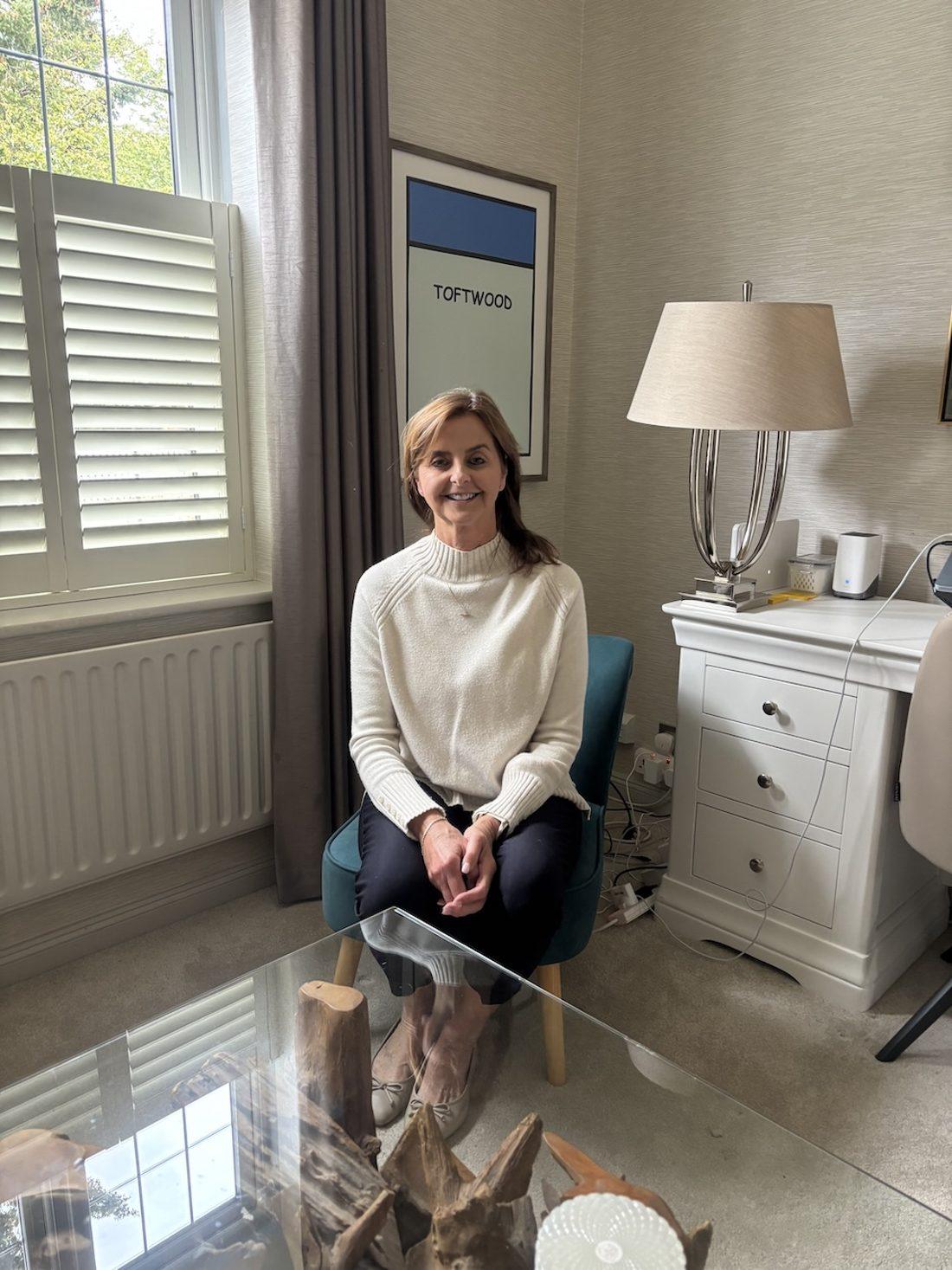Debbie Pell seated in her calm, private consulting room, where face-to-face sessions take place